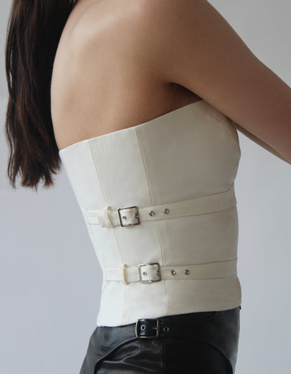 Side view of the SP_CE.01 Interlace Corset in woven wool, with interlacing straps that buckle at sides.